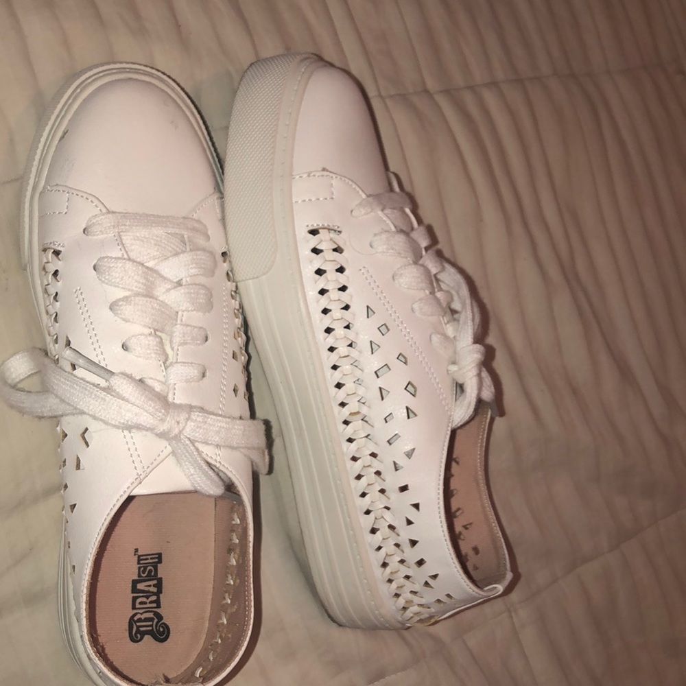 Sneakers with cut outs and braid detail on sides